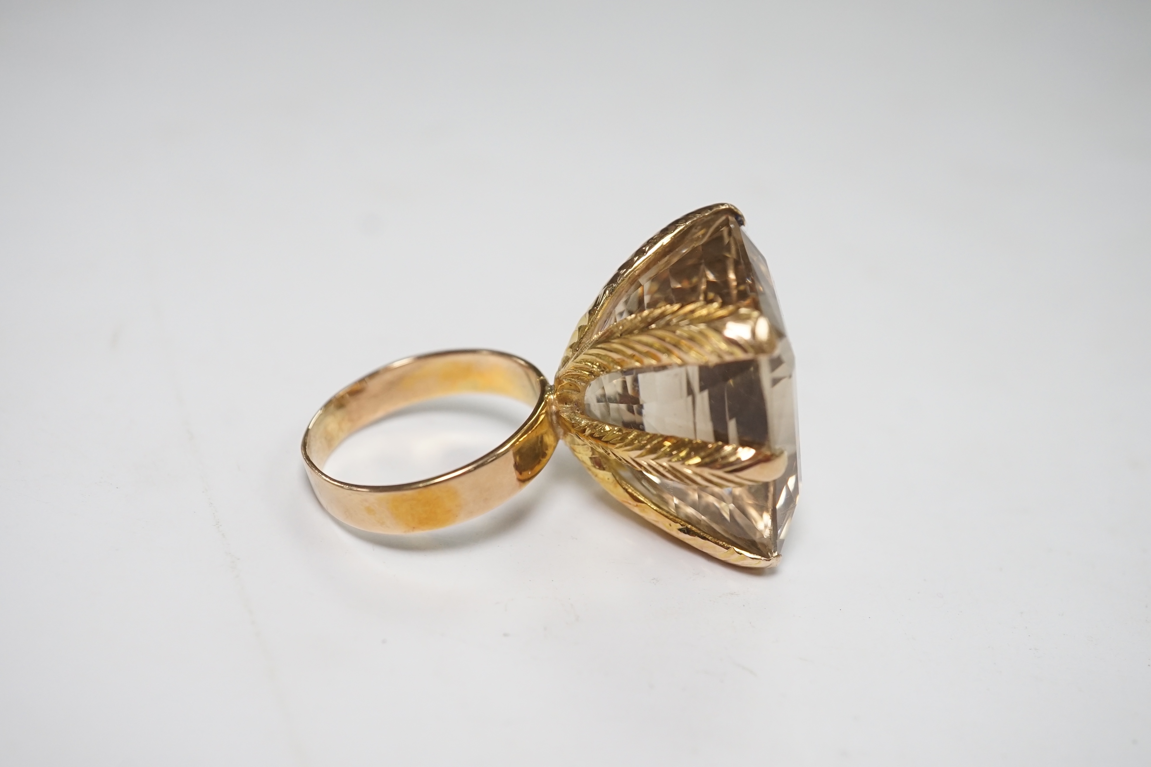 An 18k and large single stone smoky quartz set dress ring, size Q, gross weight 20.3 grams. Condition - fair to good